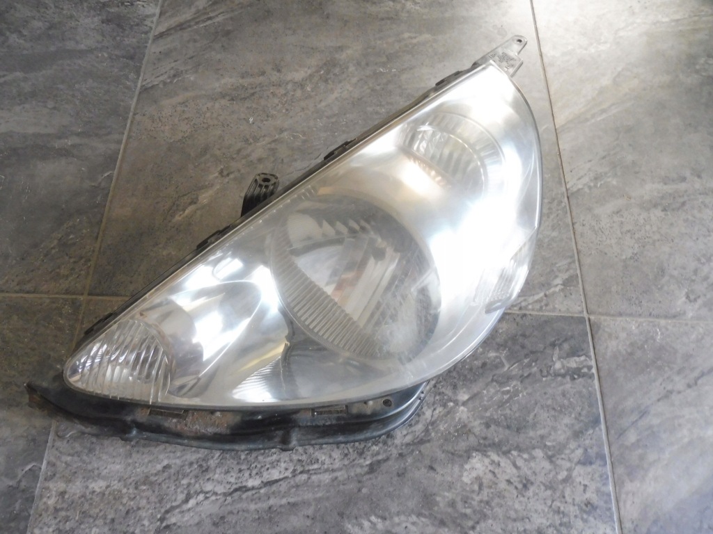 фото №1, Honda jazz ii lift 2004- лампа передняя левая p2187 + молдинг