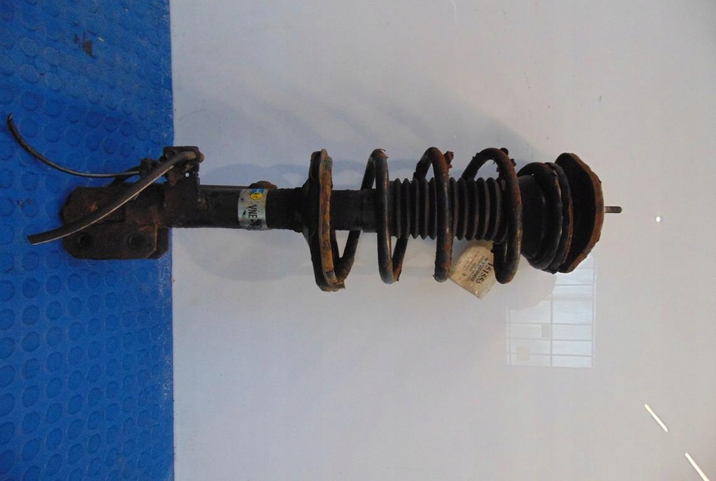 фото №1, Toyota corolla e12 2.0d амортизатор левый перед