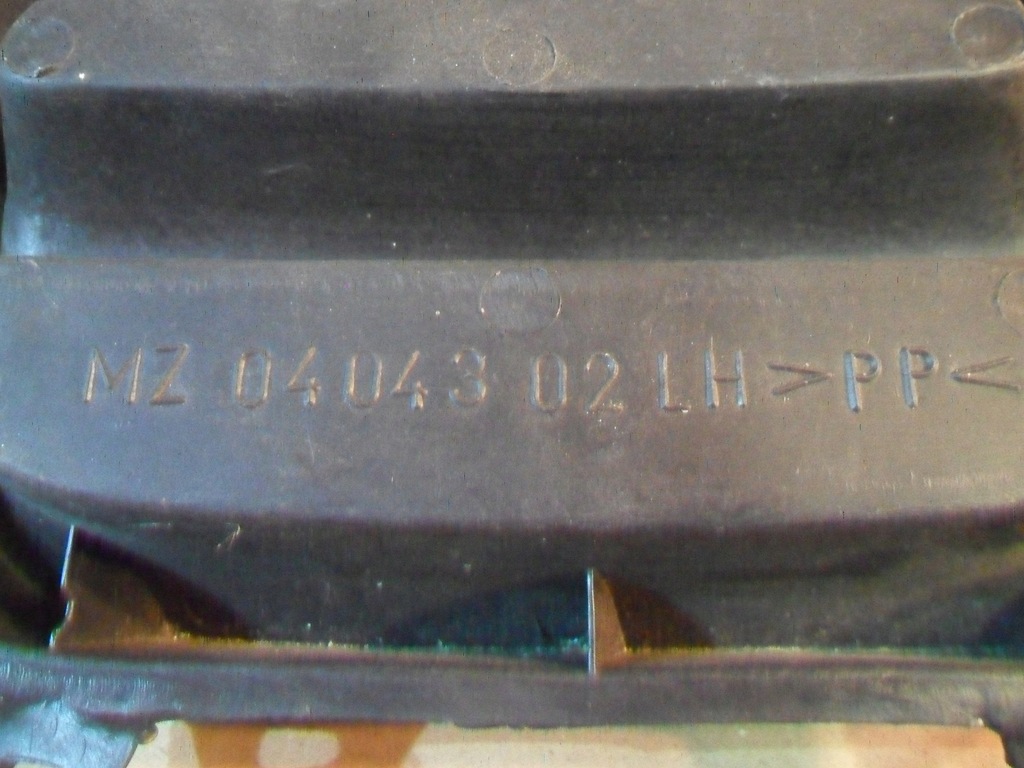 фото №14, Mazda 323 заглушка бампера ліва