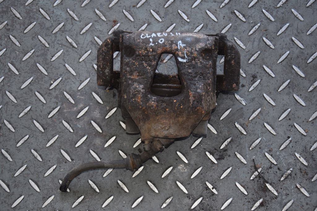 фото №1, Супорт гальмівний лівий перед kia clarus ii 2.0