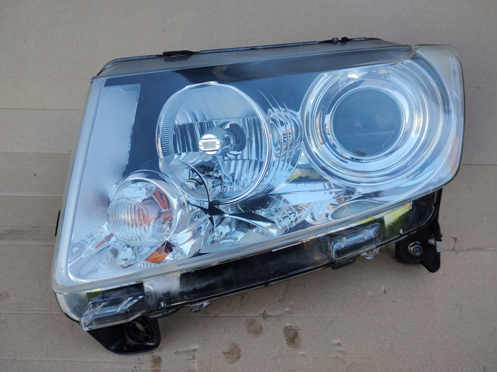 фото №1, Фара лампа передняя левая jeep compass i lift 2011 05182553ad europa