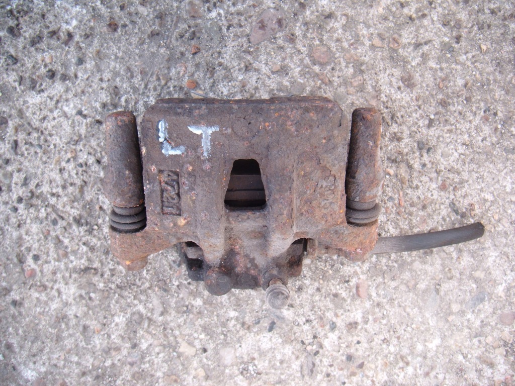 фото №1, Grandis 03-11 2.4 суппорт тормозной левый задняя