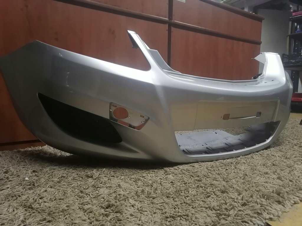 Бампер zafira b z157 рестайлинг  с решётки Недорого