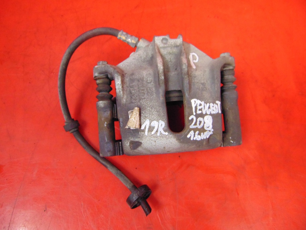 фото №1, Peugeot 208 i суппорт тормозной правый перед