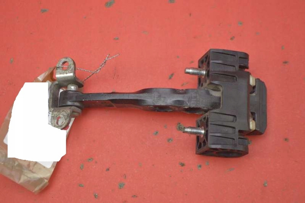 фото №1, Обмежувач двері лівий перед 60690659 alfa romeo 159 kombi 05-11