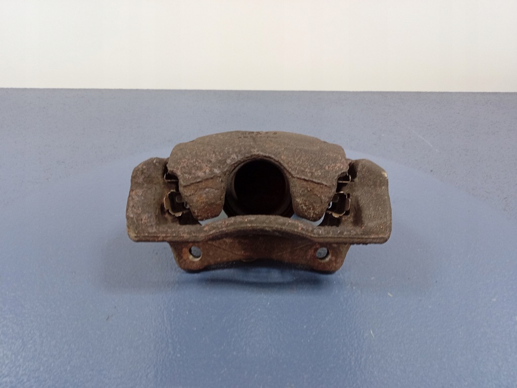 фото №1, Micra iii k12 1.2 16v суппорт перед левый скоба