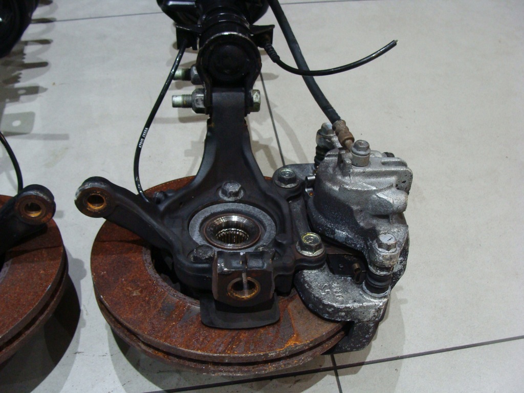 фото №6, Амортизатор поворотний кулак ліва nissan nv200 lift !