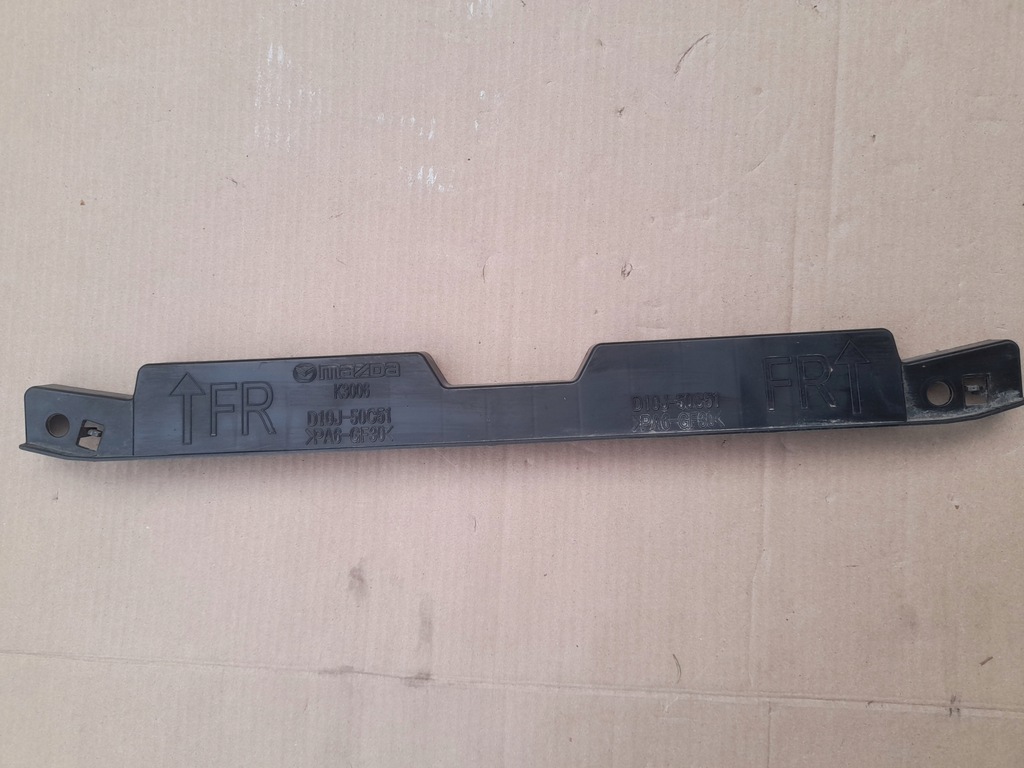 фото №1, Mazda оригінальний номер d10j-50c51 напрямна кронштейн бампера