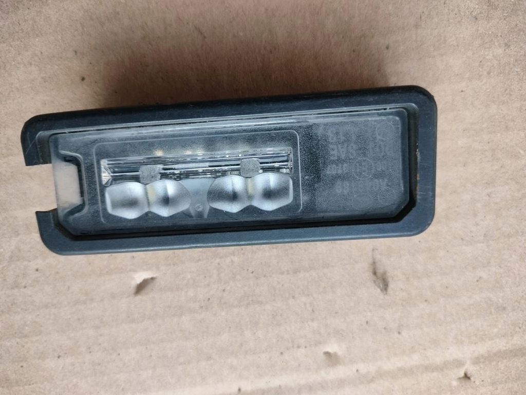 фото №1, Лампа освещение номерного знака регистрационный оригинал