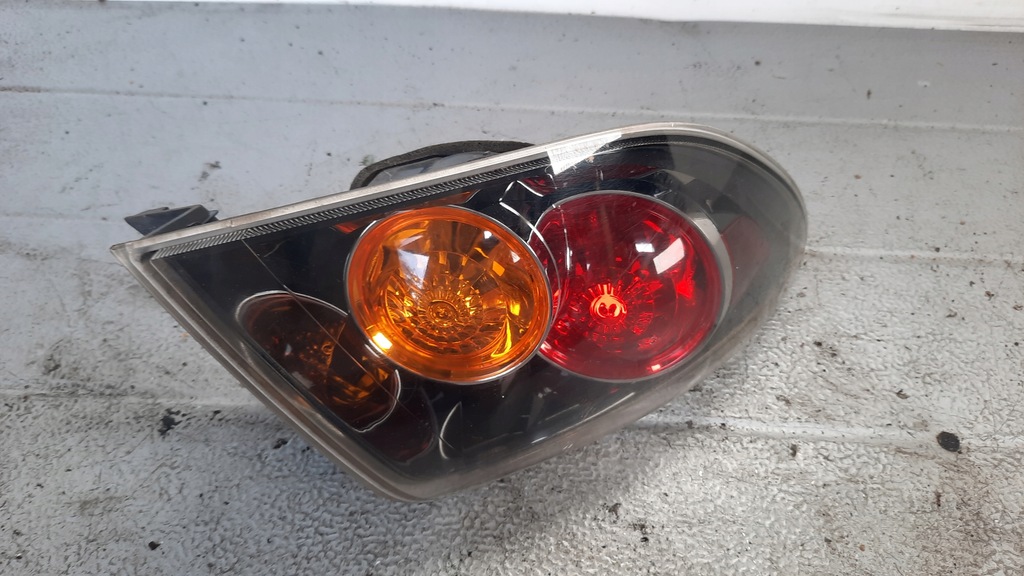 фото №1, Лампа левая задняя mazda 3 05r hb