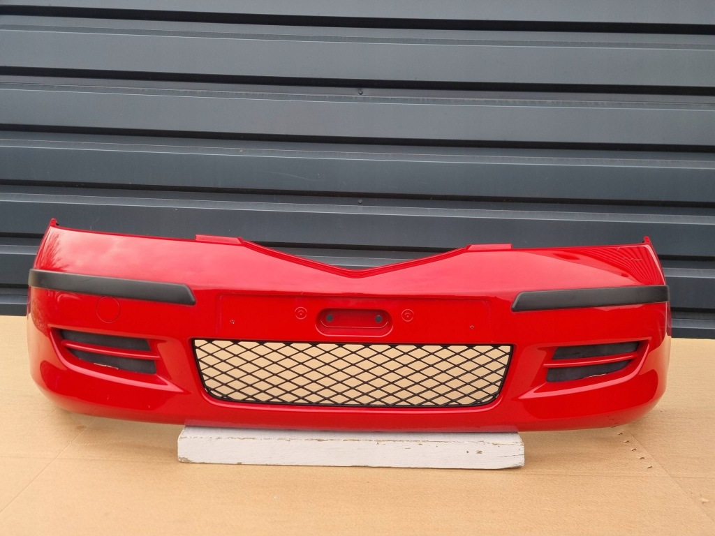 фото №1, Mazda 2 dy 2007- бампер перед оригинал c264