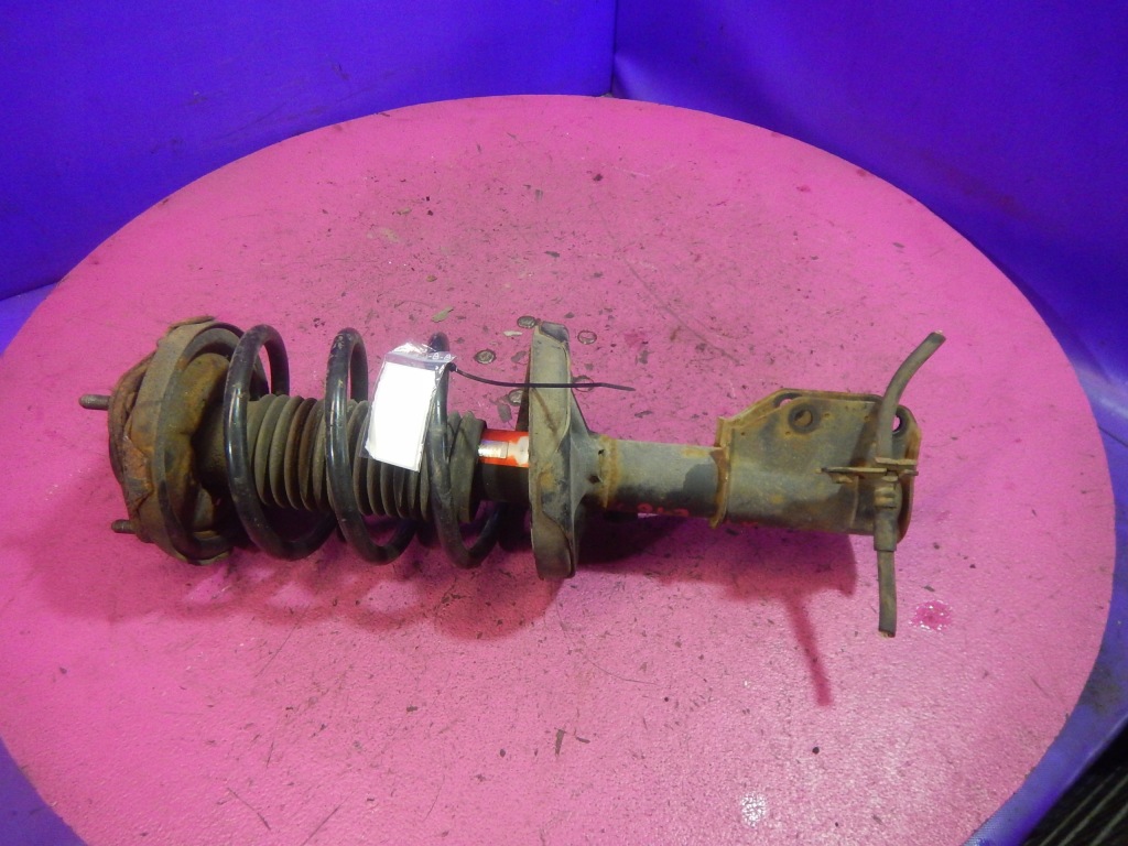 Купить Mazda 323f bj 1,6 амортизатор mcperson перед левая