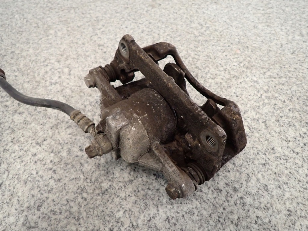 фото №4, Suzuki ignis 1.3i 04- супорт передній правий