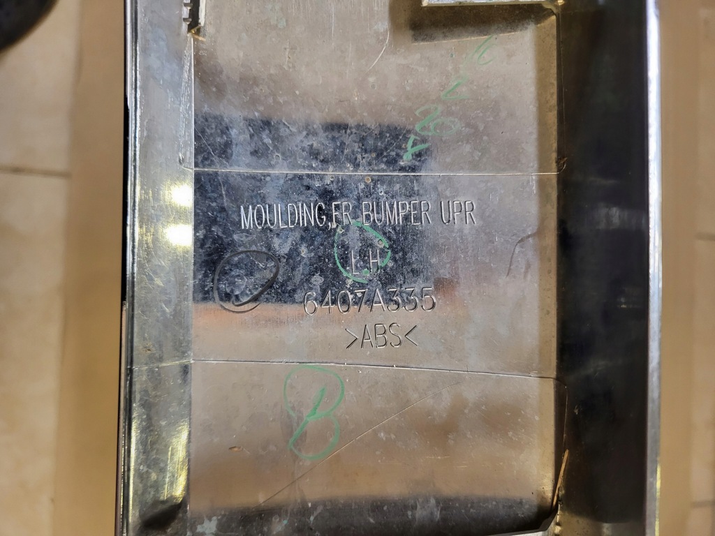 фото №10, Молдинг хромированная бампера передний левая mitsubishi l200 v lift оригинальный номер