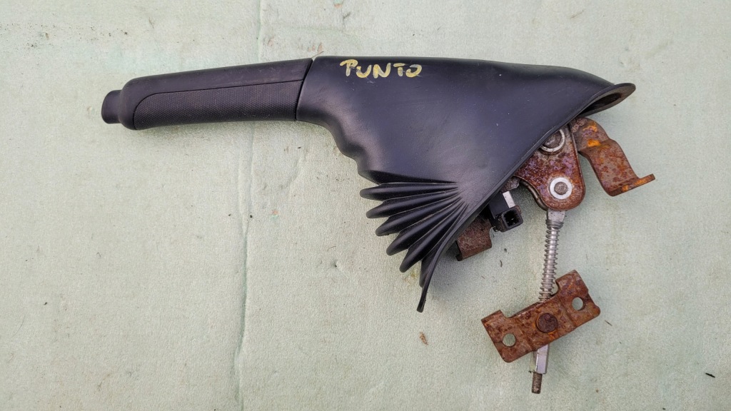 фото №1, Grande punto evo ручной рычаг тормоза ручного