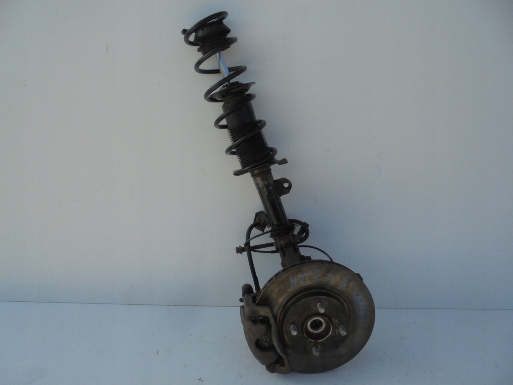 фото №1, Nissan note ii e12 амортизаторна стійка поворотний кулак ліва