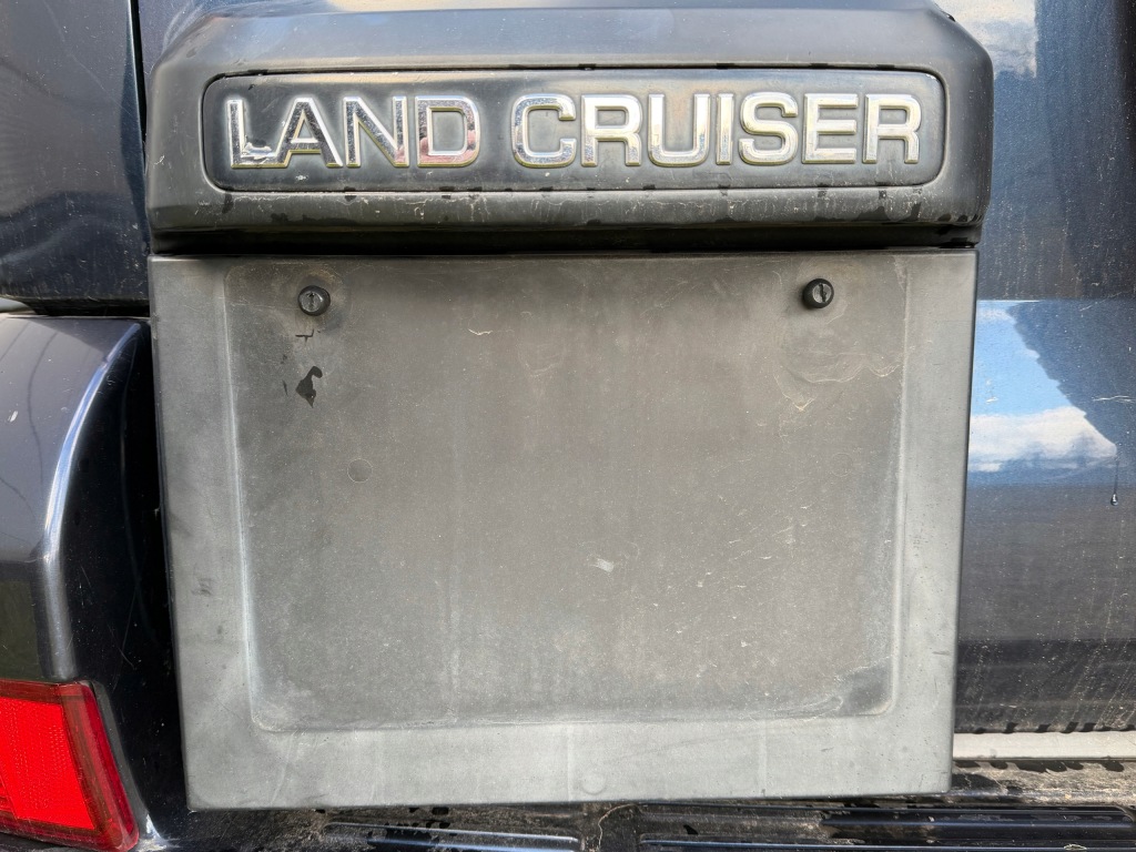 фото №1, Підкладка рамка освітлення номерного знака toyota land cruiser 120 oem накладка