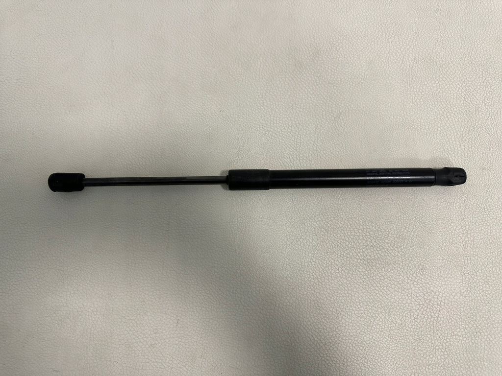 фото №1, Tesla model 3 привід амортизатор капот 1091472-00