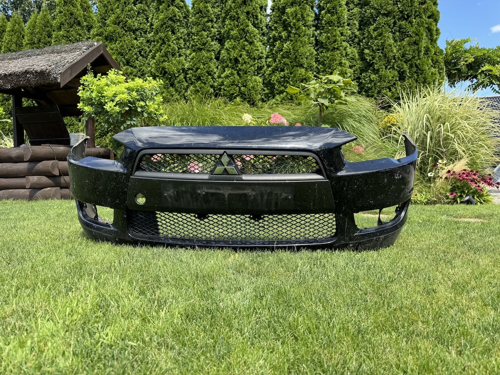 фото №1, Mitsubishi lancer x sedan 09- бампер передний + решётка радиатора оригинал