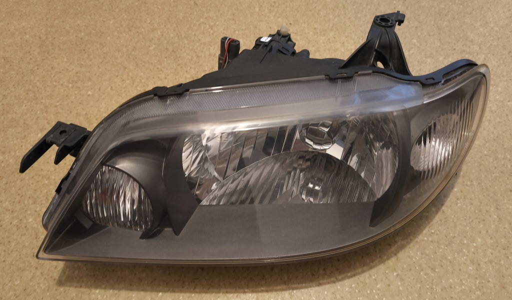 Купити Mazda 323f bj рестайлінг  фара лівий 176