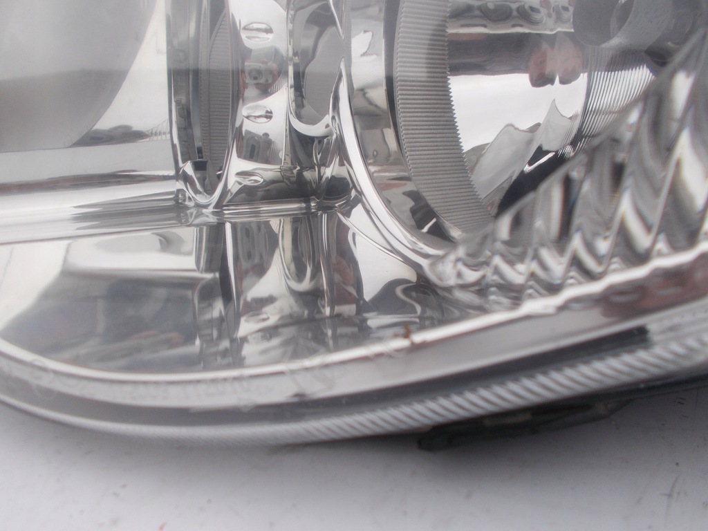 фото №8, Фара лампа chrysler voyager iv lift левый