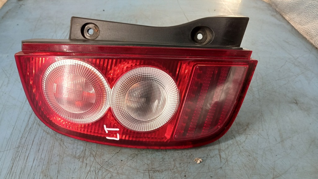 фото №1, Лампа задняя левая nissan micra 1.2b 04r