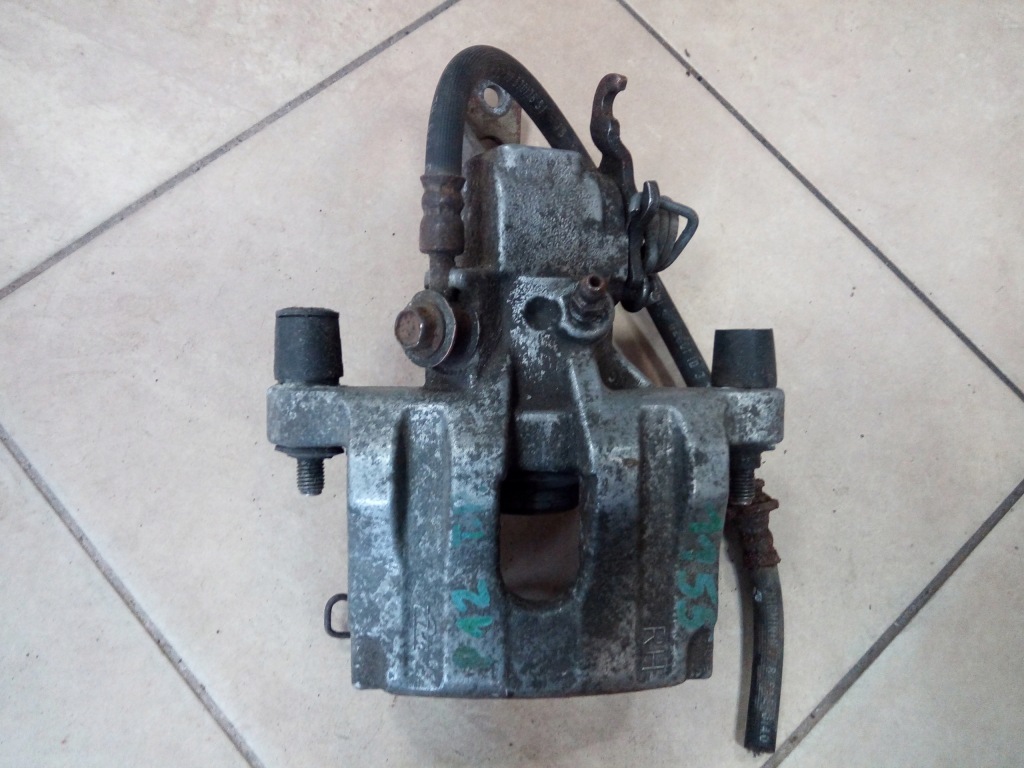 фото №2, Супорт гальмівний nissan primera p12 задня oryg ate