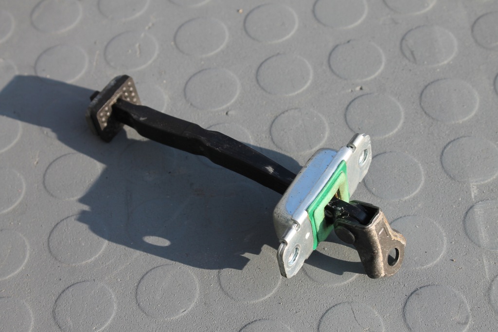 фото №1, Обмежувач двері лівий перед santa fe ii 06-12