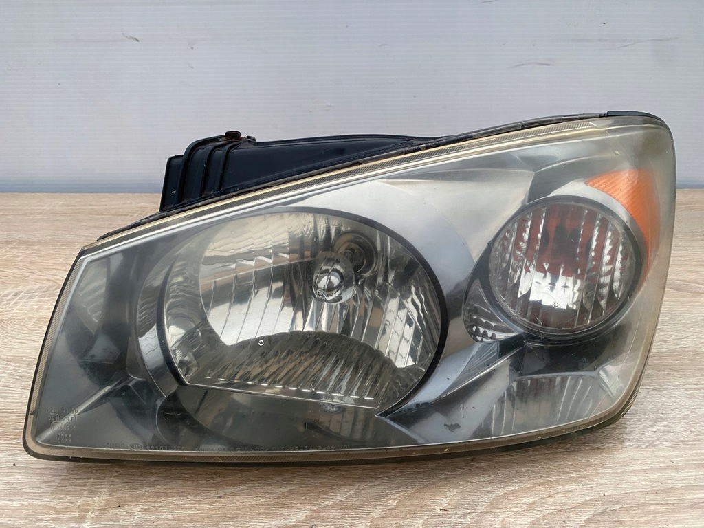 фото №1, Лампа фара лівий перед kia cerato i + вкладиш - 921012f0