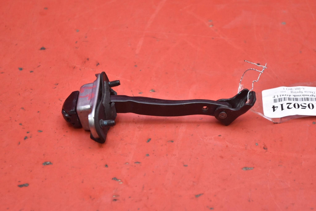 фото №1, Обмежувач двері лівий перед dacia spring 21-